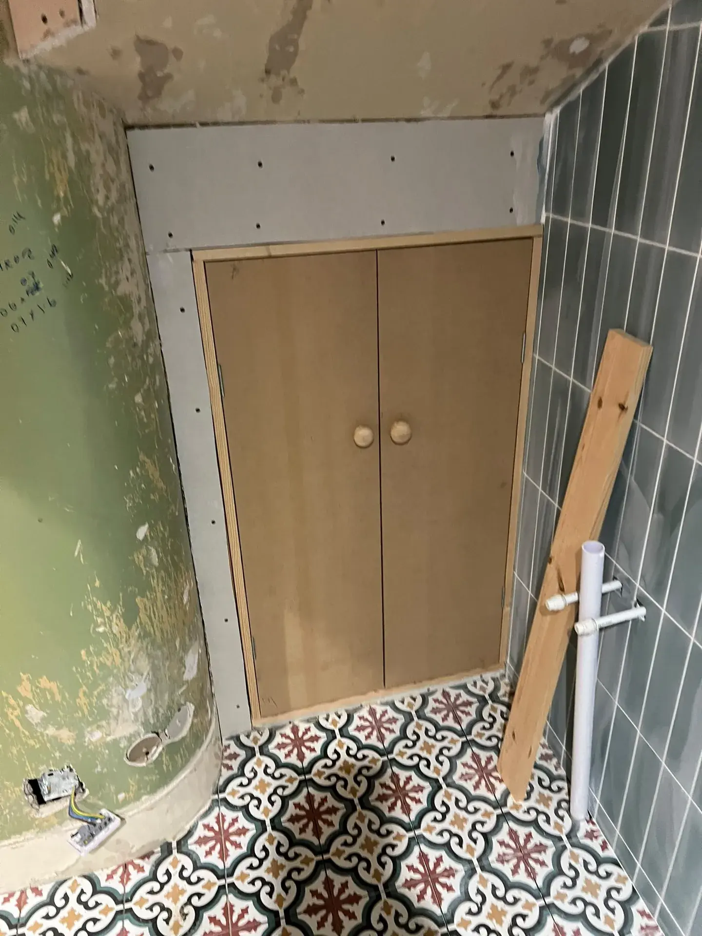 Timber door and frame being fitted