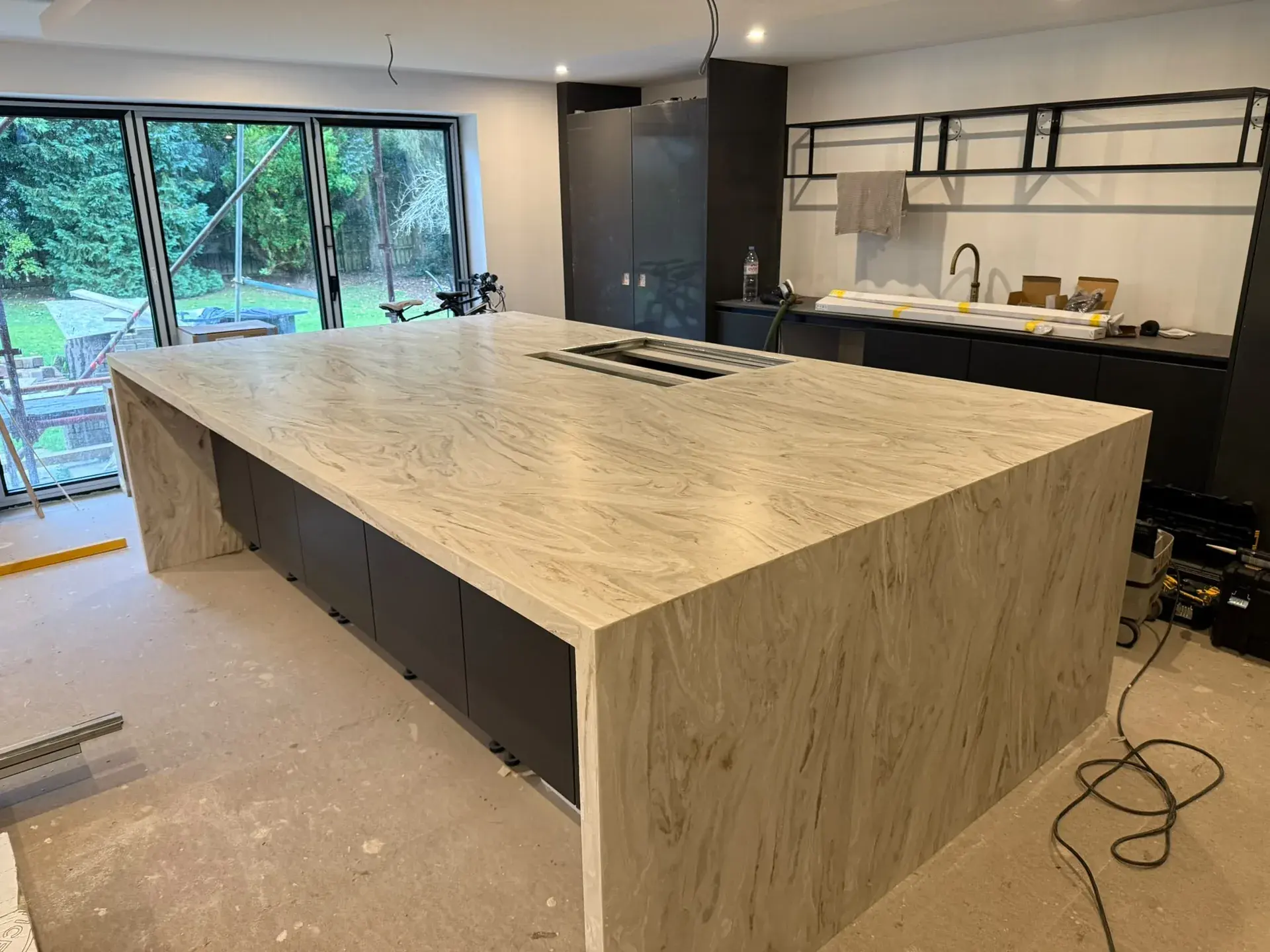 Large veined island worktop with waterfall ends